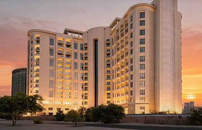 Hotel apartment exterior at dusk